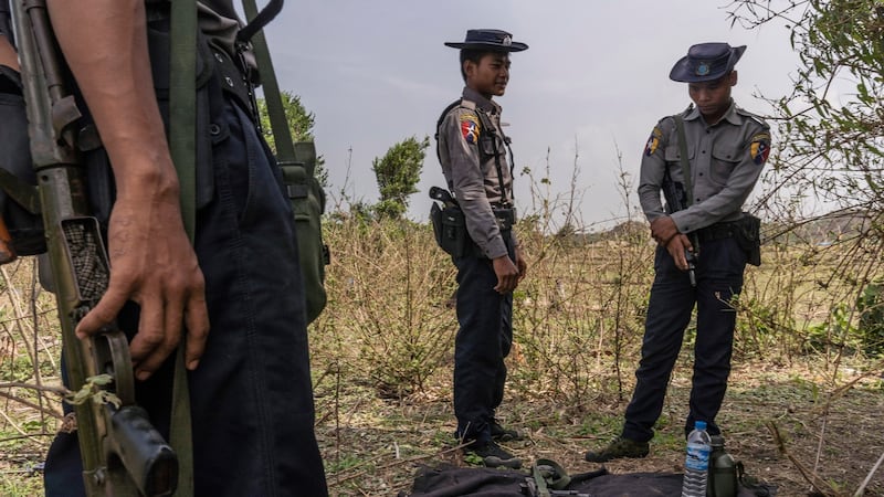 Myanmar police shelter in the shade of a tree near Inn Din village, Myanmar. Over 730,000 Rohingya fled to Bangladesh two years ago to escape a campaign of ethnic cleansing. Photograph: Adam Dean/New York Times