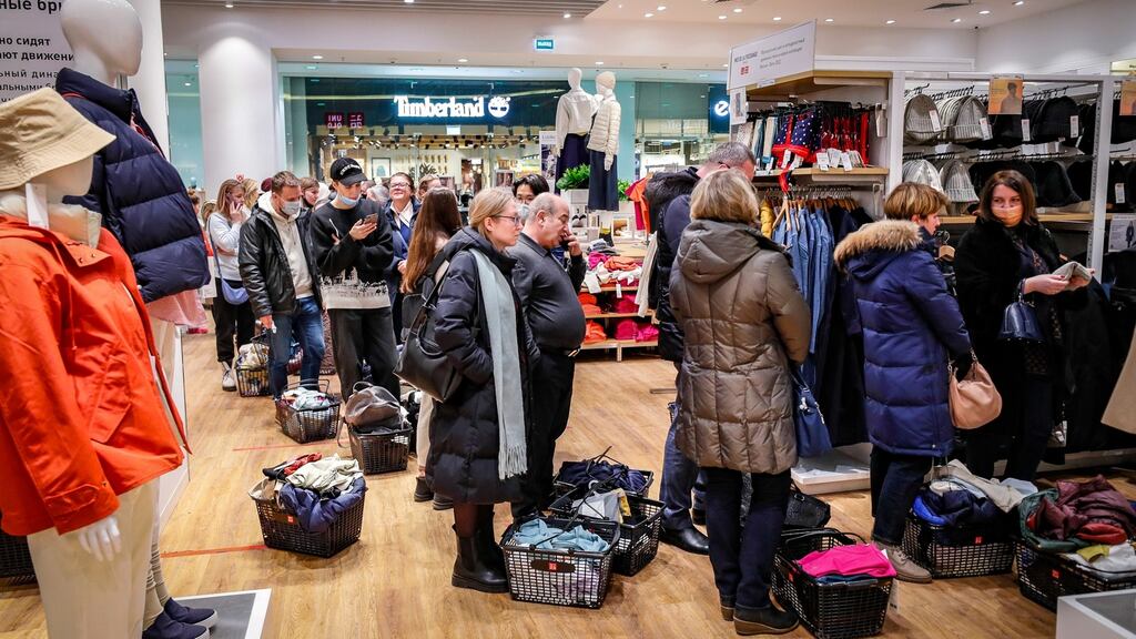 Muscovites queue to buy clothes at Japanese chain Uniqlo, which is suspending activities in Russia. Some 50 brand stores will close from March 21st. Photograph: EPA