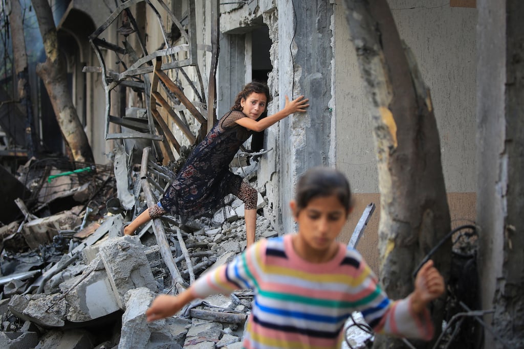 A Palestinian girl climbs over debris in Nuseirat, central Gaza, on Sunday, a day after an operation by Israeli special forces to free four hostages taken by Hamas in its attack on Israel on October 7th. Photograph: Eyad Baba/AFP via Getty Images