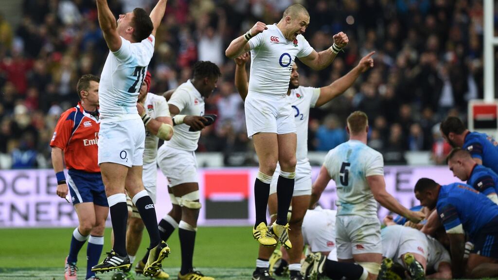 England players Ben Youngs and Mike Brown jump for joy after England completed the Grand Slam with victory over France in Paris. Photograph: Franck Fife/AFP/Getty Images