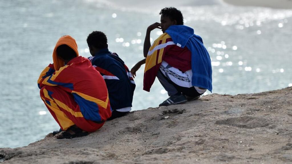 Survivors of the tragedy look on at Guitgia beach on Lampedusa. Photograph: Tullio M Puglia/Getty Images