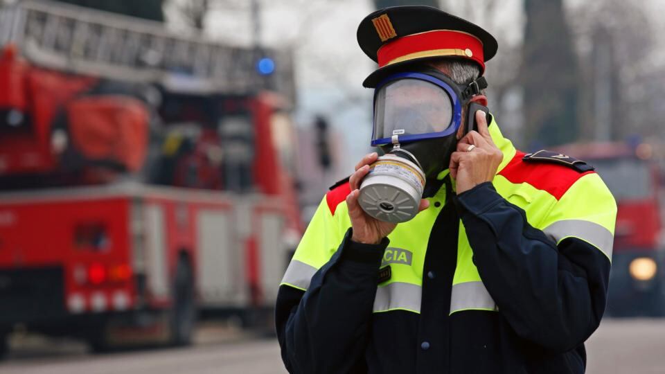 A Catalan “Mosso d’Esquadra” police officer wearing a gas mask after an explosion at a chemical plant caused a toxic cloud to spread over Igualada near Barcelona on February 12th, 2015. Photograph: Reuters
