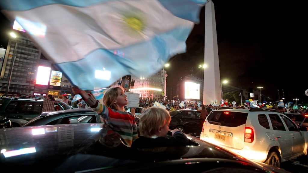 Supporters of the victorious presidential hopeful of the Cambiemos party, Mauricio Macri celebrate his win in downtown Buenos Aires on November 22, 2015. Photograph: Emiliano Lasalvia/AFP/Getty Images