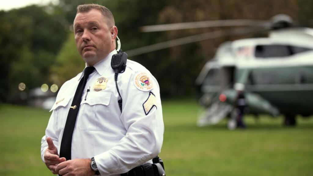 A uniformed member of the Secret Service stands guard at the White House. Photograph: Doug Mills/ The New York Times