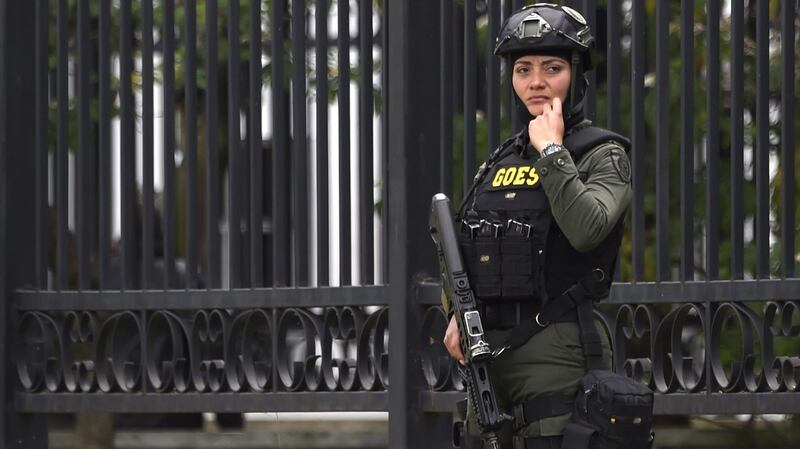 A member of the security forces stands guard at the explossion site. Photograph: Juan Barreto/AFP/Getty Images