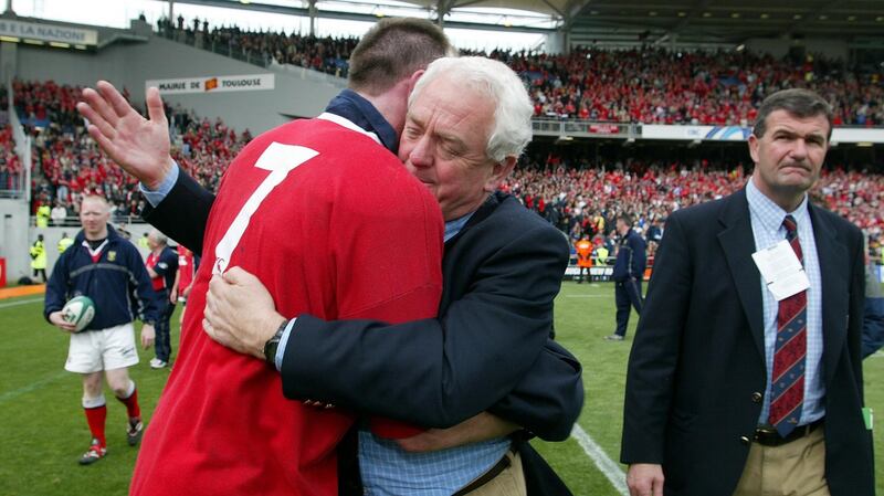 Trevor Brennan and Alan Gaffney embrace after Munster’s defeat to Toulouse in 2003.  Photograph: Patrick Bolger/Inpho