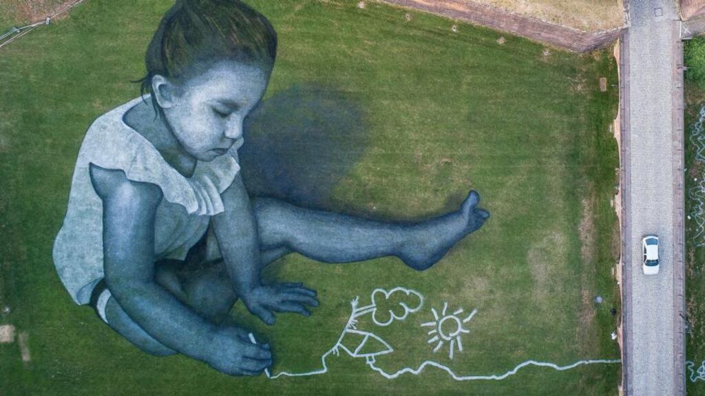 Saype: one of the artist’s field murals, created for a French festival. Photograph: Sebastien Bozon/AFP/Getty