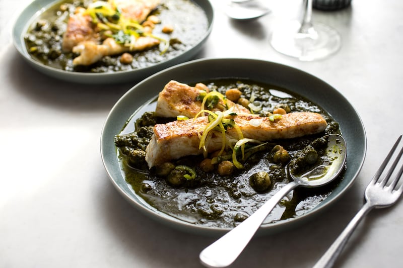 Yotam Ottolenghi’s spiced halibut with spinach and chickpea stew. Photograph: Andrew Scrivani/New York Times