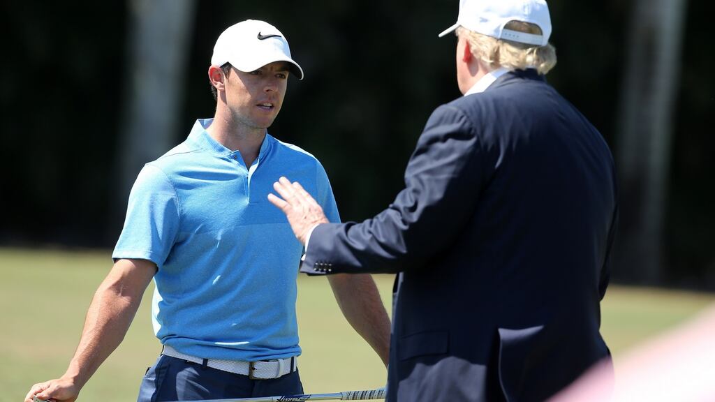 Republican presidential candidate Donald Trump makes an appearance prior to the start of play and speaks with golfer Rory McIlroy of Northern Ireland during the final round of the World Golf Championships-Cadillac Championship at Trump National Doral Blue Monster Course. Photo: Mike Ehrmann/Getty Images