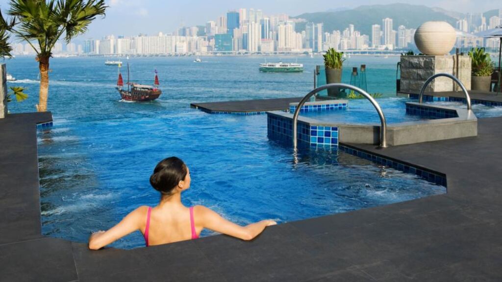 The rooftop pool of the InterContinental hotel in Hong Kong.  IHG has agreed to sell InterContinental Hong Kong to a consortium of investors for $938 million.