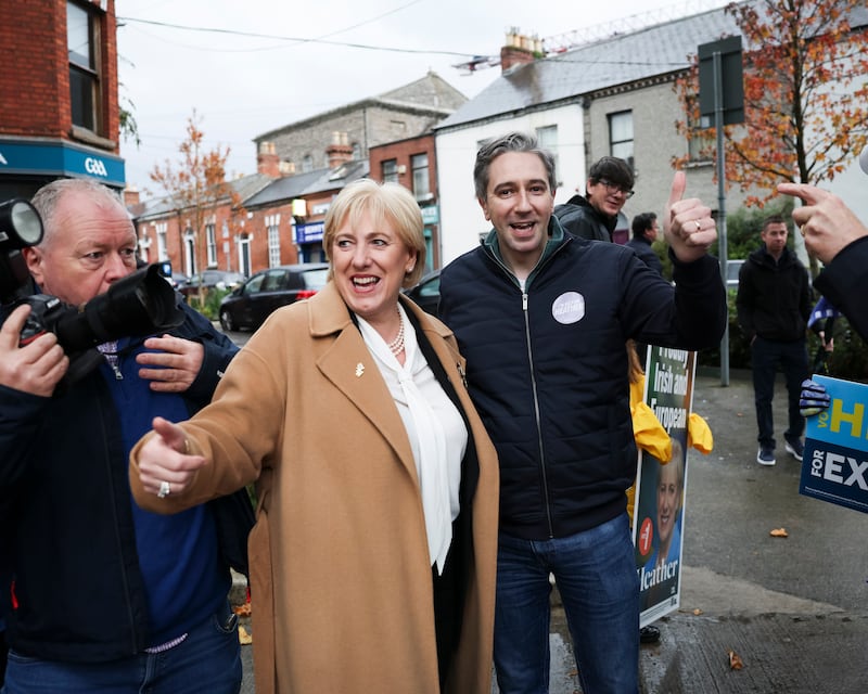 Presidential candidate Heather Humphreys with Tánaiste Simon Harris on the streets around Croke Park ahead of the Leinster v Munster game on Saturday. Photograph: Dan Dennison/ The Irish Times