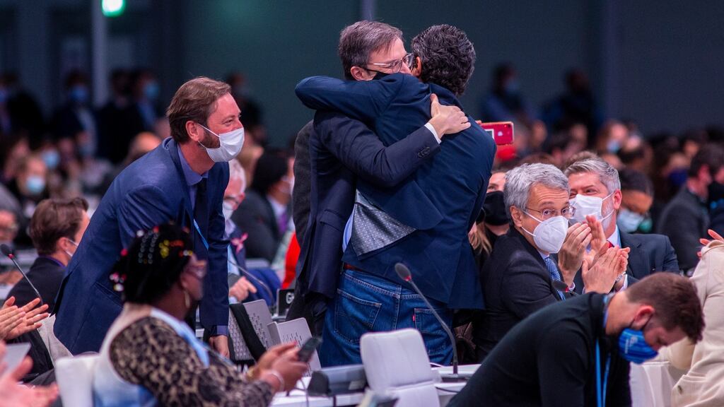 Exhausted Cop26 delegates as they emerged from the final plenary after two weeks of talks. Photograph: Robert Perry/EPA
