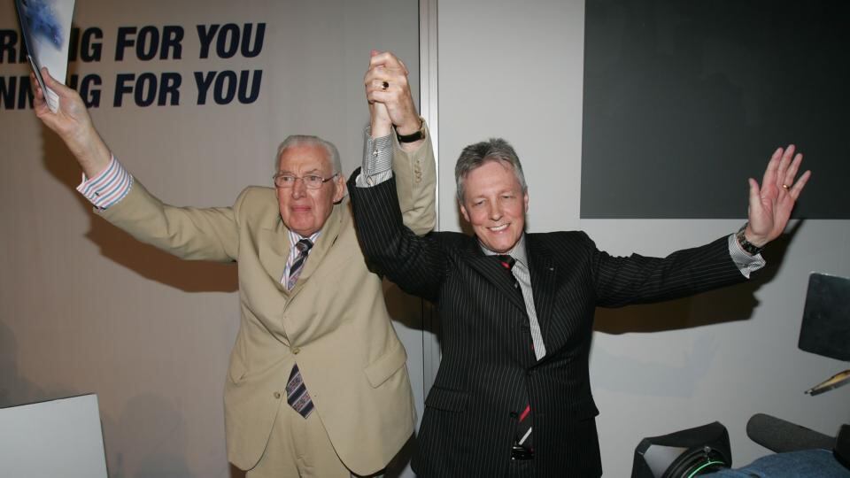 Ian Paisley and his successor Peter Robinson salute the crowd after Dr Paisley’s final address to a gathering of DUP members in Belfast to mark his retirement as leader of the party in may 2008. Photograph: Alan Betson/The Irish Times