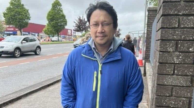 Medical scientist Peter Chuk protesting outside Cork University Hospital on Wednesday.