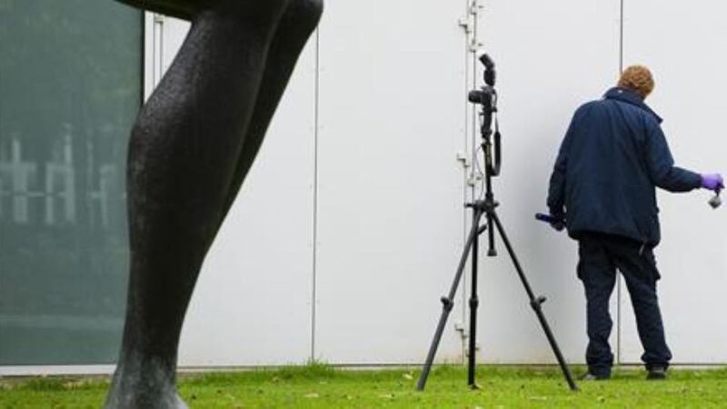 Police conduct a forensic examination of the crime scene. Photograph: Reuters