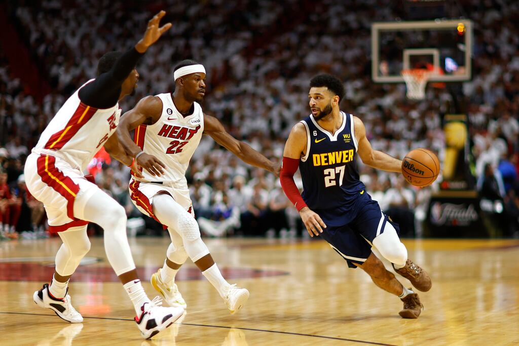 Jamal Murrayo f the Denver Nuggets dribbles against Jimmy Butler of the Miami Heat during the first quarter in Game Four of the 2023 NBA Finals at Kaseya Center. Photograph: Mike Ehrmann/Getty Images