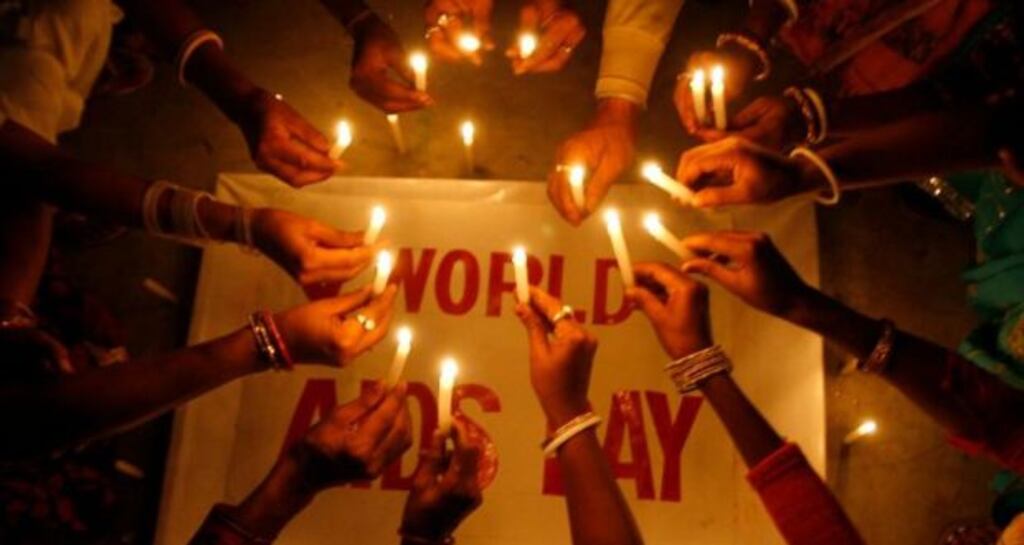 File photograph of people suffering from HIV/AIDS holding candles for World AIDS Day. Photograph: Rupak De Chowdhuri /Reuters