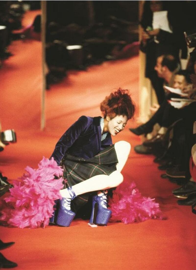 Naomi Campbell tumbling off her purple leather platforms at Vivienne Westwoods Spring/Summer 1993 collection in Paris. Photograph: Niall McInerney