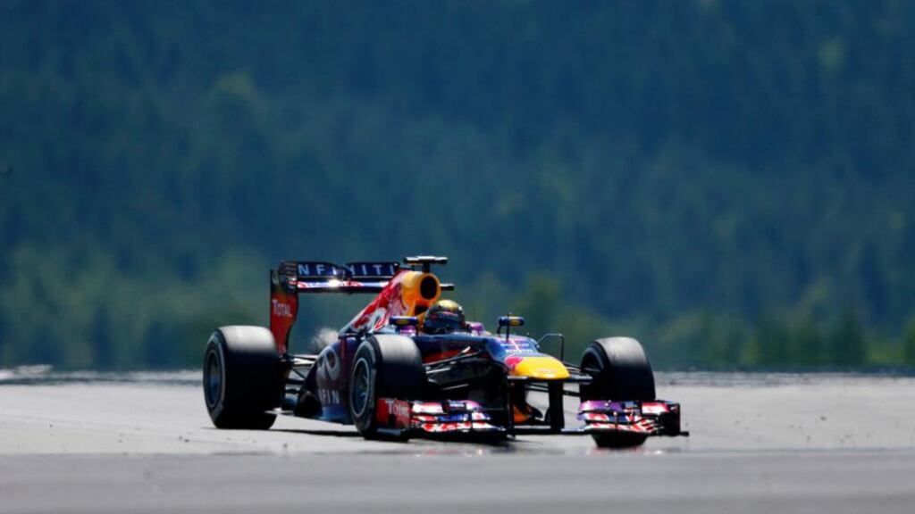 Red Bull driver Sebastian Vettel takes a corner during the German Grand Prix at the Nuerburgring circuit. Photograph: Wolfgang Rattay/Reuters