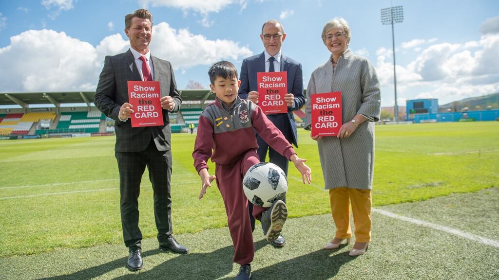 Colin Bell, Republic of Ireland women’s manager, Martin O’Neill and Minister for Children and Youth Affairs Katherine Zappone with Kevin Nguyen from St Aidan’s school in Dublin at the annual Show Racism the Red Card awards ceremony at Tallaght Stadium. Photograph: Barry Cronin