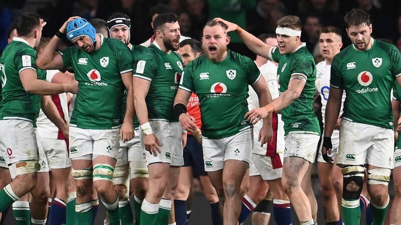 Finlay Bealham is congratulated by Ireland team-mates after his try secured the bonus point at Twickenham. Photograph: Andy Rain/EPA