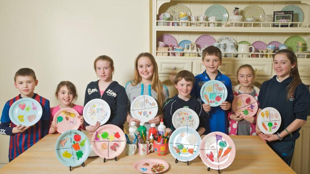 Terenure schoolchildren Cillian McCabe, Caolainn McCabe, Alannah Murphy, Aisling Phelan, Darragh Murphy, Gavan Coyle, Rachel Coyle and Amy McCabe from St Joseph’s BNS and Presentation Primary School displaying the portion plates they designed as part of the Get Wise About Portion Size campaign. Photograph: Ned Kelly