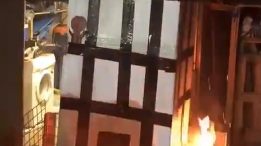 A video posted on social media of a model of Grenfell Tower being burned over a fire.Photograph: PA