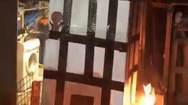 Police search house over Grenfell bonfire video