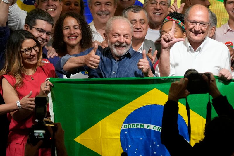 Luiz Inacio Lula da Silva celebrates (Andre Penner/AP)