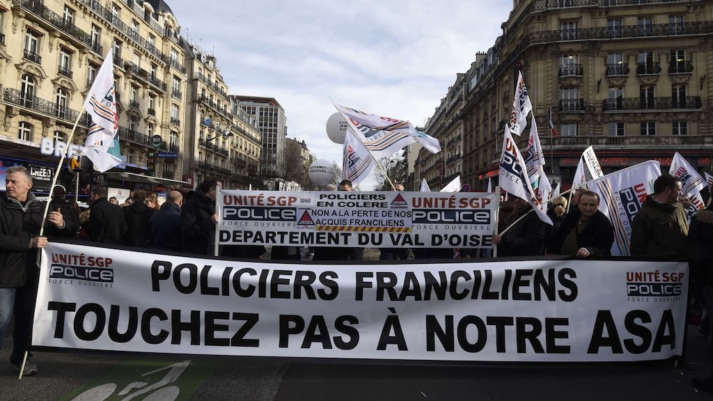 Policemen from the Ile de France region hold a banner reading “Don’t touch our years of services benefits” as they demonstrate in Paris on Tuesday. Photograph: Dominique Faget/AFP/Getty Images