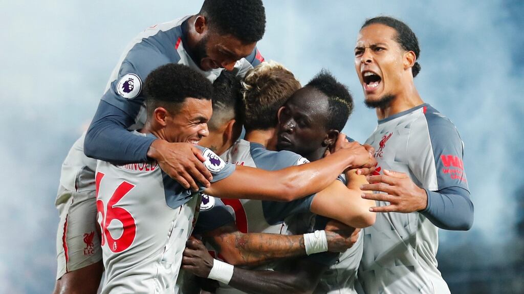 Liverpool’s Sadio Mane celebrates scoring their second goal with team mates in the match against Crystal Palace. Photgraph: Eddie Keogh/Reuters