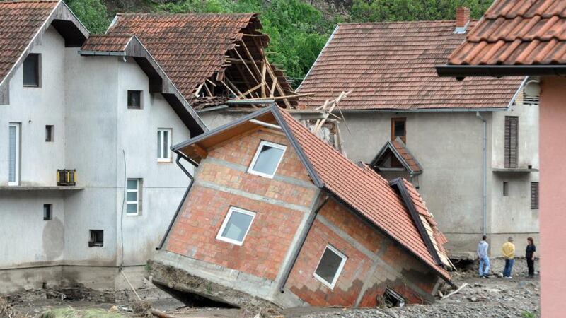 Damaged houses after flooding in Krupanj, 150 km southeast of Belgrade in  Serbia yesterday. Photograph: EPA
