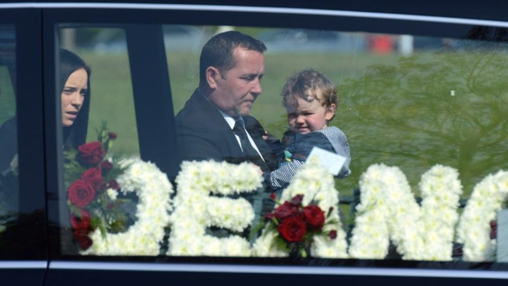 Dean Fitzpatrick’s father Christopher, carrying Dean’s son Leon and followed by Dean’s girlfriend Sarah O’Rourke, arrives at the Holy Trinity church in Donaghmede for Mr Fitzpatrick’s funeral. Photograph: Cyril Byrne