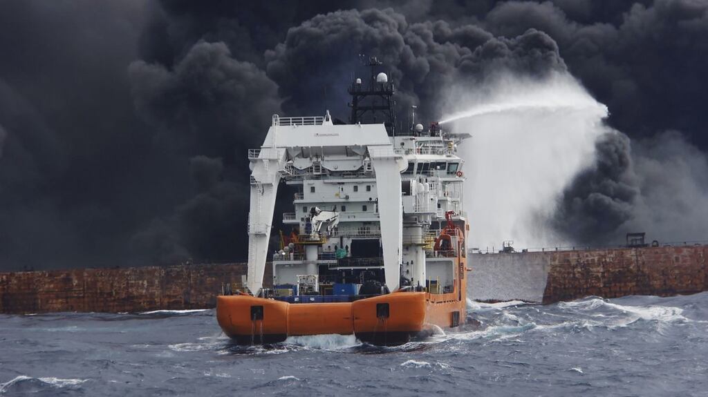 Chinese supply ship ‘Shen Qian Hao’ spraying foam on the burning oil tanker ‘Shanchi’ on Friday. Photograph: Chinese Transport Ministry/EPA