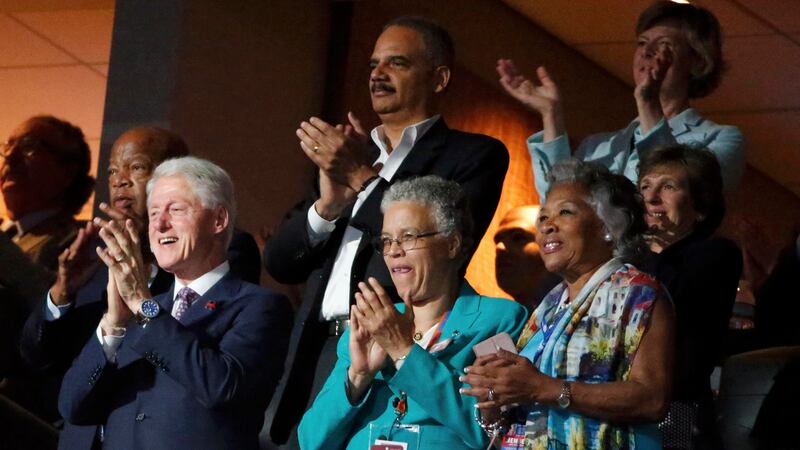 Former US president Bill Clinton applauds First Lady Michelle Obama’s speech. Photograph: Lucy Nicholson/Reuters
