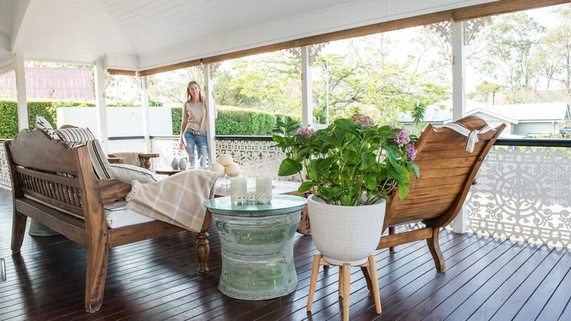 Teak-floored verandah with tropical hardwood furniture.