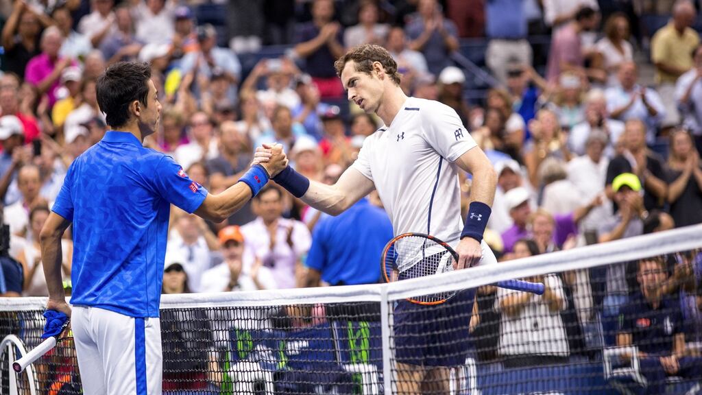 Andy Murray congratulates Kei Nishikori after the Japanese player won their quarterfinal match  at the US Open. Photograph: Uli Seit/The New York Times