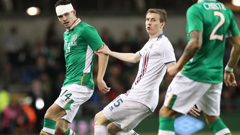 John Egan plays a pass to Cyrus Christie in the second half. Photo: Ryan Byrne/Inpho