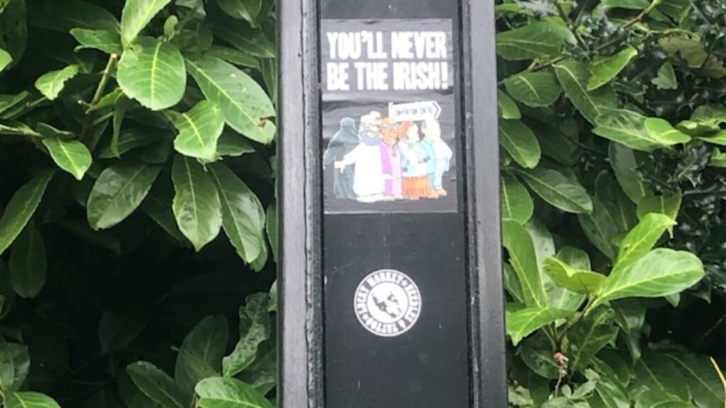 The stickers feature cartoon images of a group of migrants – including caricatures of Muslims, a man from Asia, a Roma woman and a person from Africa