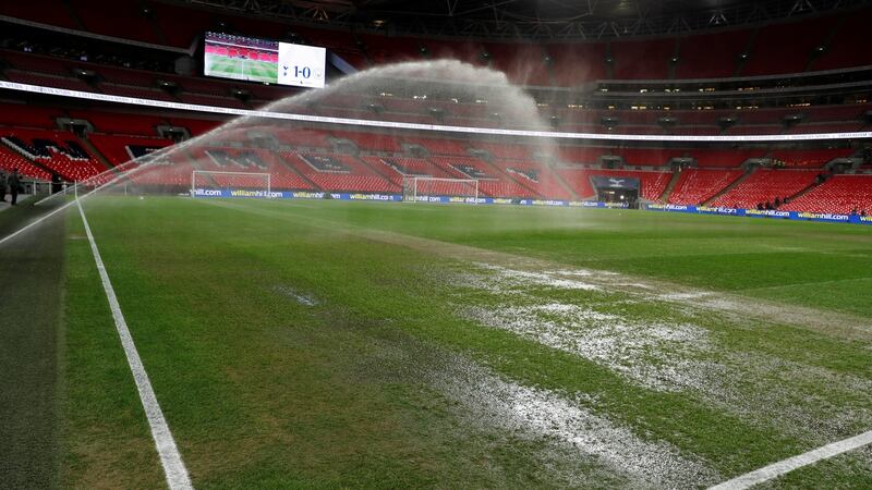 The Wembley surface is watered ahead of the Premier League game between Tottenham Hotspur and Manchester City at Wembley Stadium. Photograph: Paul Childs/Reuters