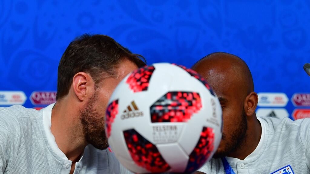 England coach Gareth Southgate talks to midfielder Fabian Delph during a press conference ahead of the World Cup third-place playoff against Belgium in St Petersburg on Saturday. Photograph: Giuseppe Cacace/AFP/Getty Images