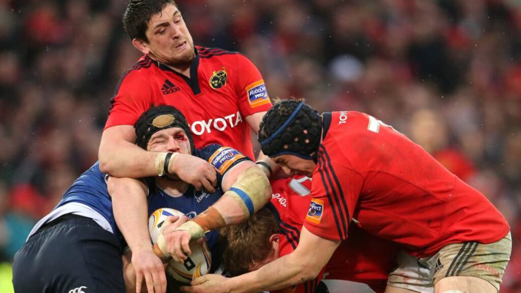 Munster’s James Downey, Stephen Archer and Tommy O’Donnell tackle Sean O’Brien of Leinster. Photograph: Cathal Noonan/Inpho