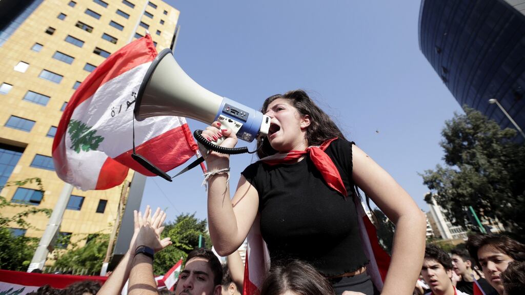 A Lebanese student takes part in an anti-government demonstration in front of the ministry of education in the capital Beirut. Photograph: Anwar Amro/APR/AFP via Getty Images
