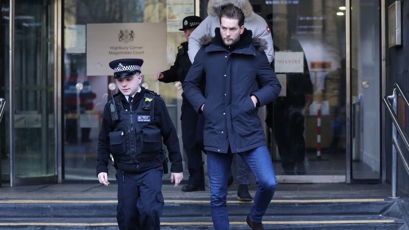 Lewis Burton on his way out of court where his girlfriend, Love Island presenter Caroline Flack has been charged with assault by beating. Photograph: PA