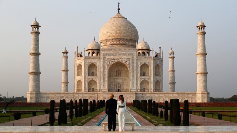 Donald Trump and first lady Melania Trump pose as they tour the historic Taj Mahal, in Agra. Photograph:  Al Drago/Reuters