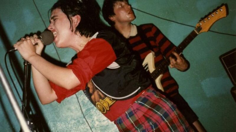 Kathleen Hanna performing with Bikini Kill