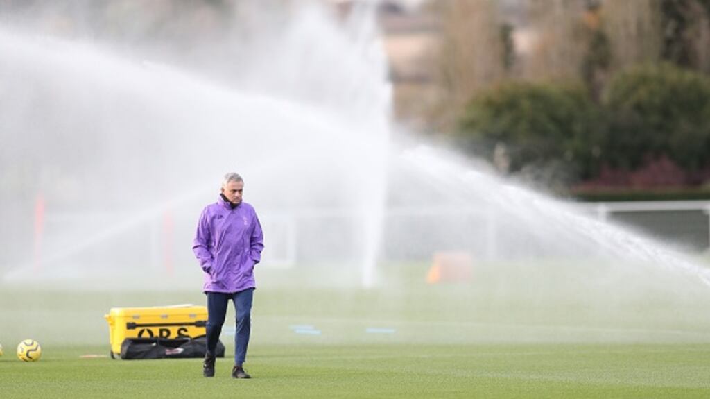 Jose Mourinho watches a training session at Tottenham Hotspur training centre in Enfield, London. Photograph: Getty Images