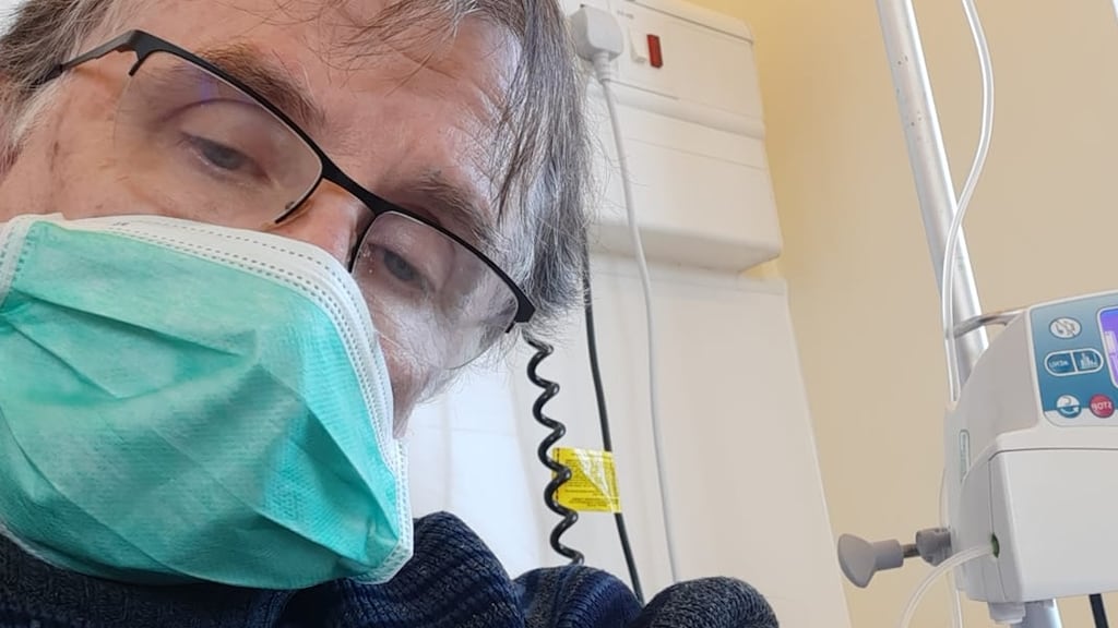 Kevin Higgins getting an infusion in hospitsl