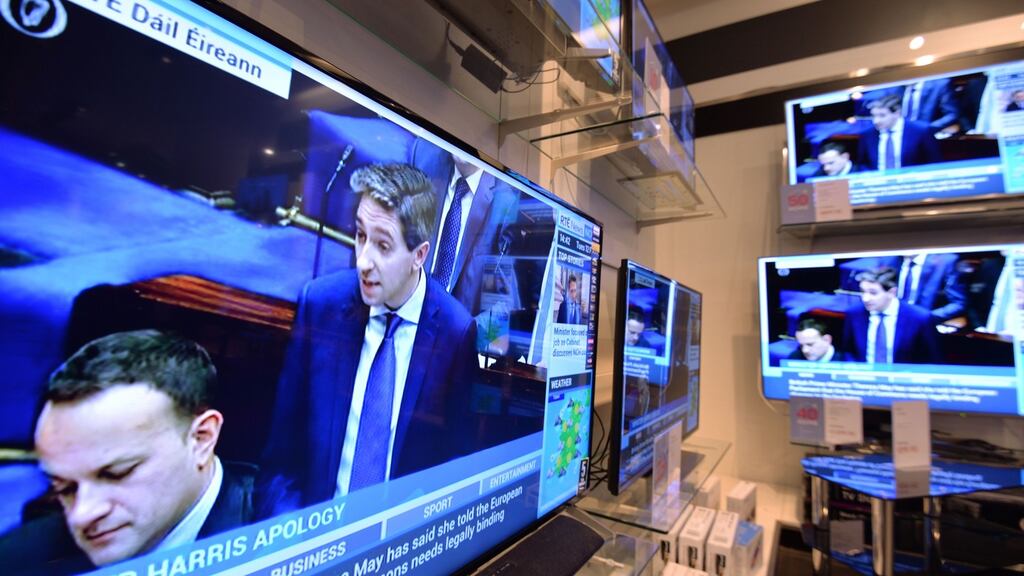 Minister for Health Simon Harris pictured in the Dail earlier this week, on televisions in Arnotts in Dublin. Photograph: Alan Betson / The Irish Times