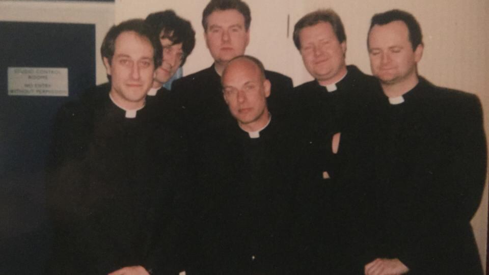 Extra, extra, read all about it: Fr Greg Kyle, the show’s casting director; Fr Liam Mackey (Irish Examiner soccer correspondent); Fr Liam Fay (TV critic of the Irish Sunday Times); Fr Brian Eno, (possibly a downtable sub on the Indo?); Fr Martin Doyle (assistant literary editor of The Irish Times); and Fr Ken Sweeney (entertainment editor of the Irish Sun).